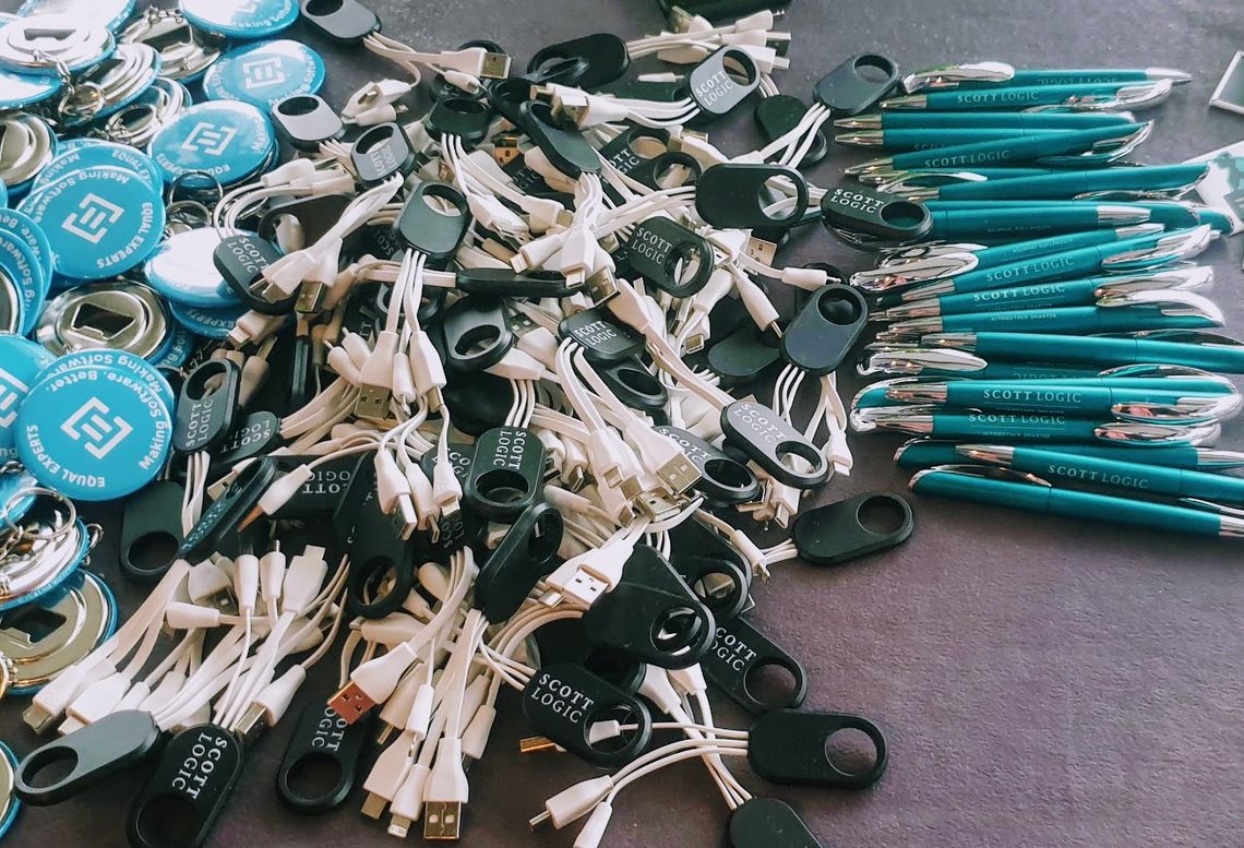 Pens and phone power adapters on Testbash swag table